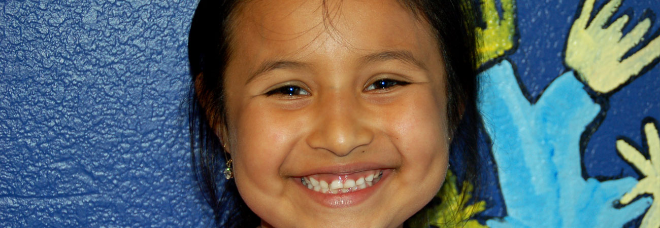 girl-smiling-painted-background